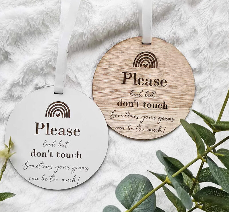 no touching sign with rainbow